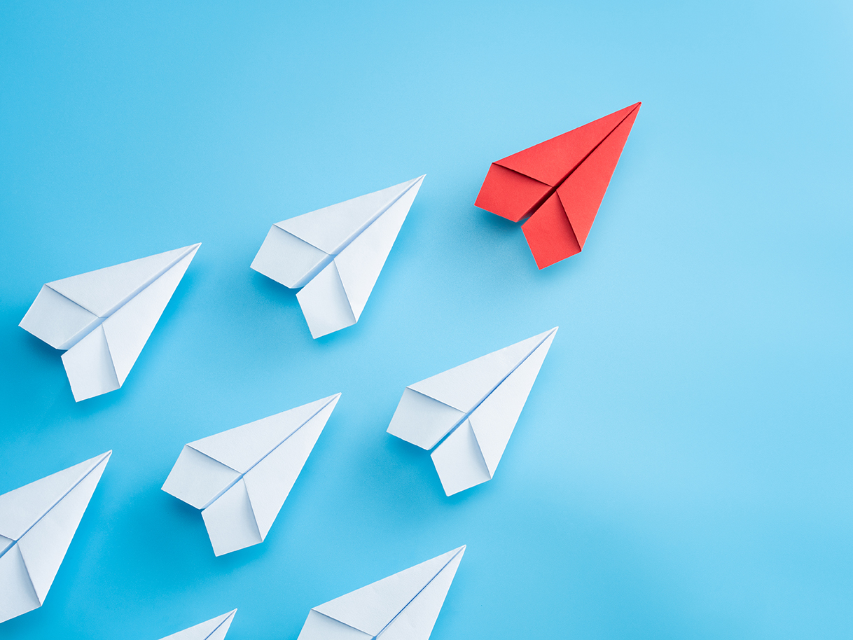 illustration of paper planes following leader